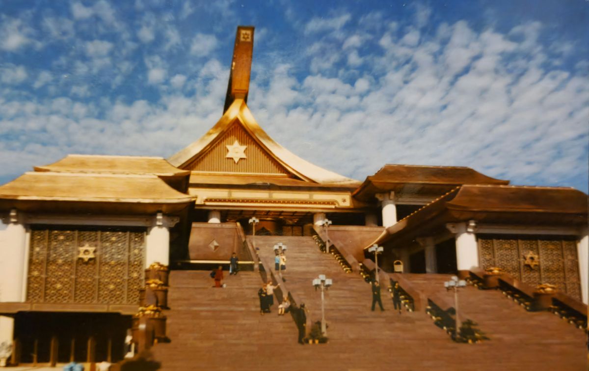 Gold-roofed main shrine in Takayama, Japan, under a blue sky